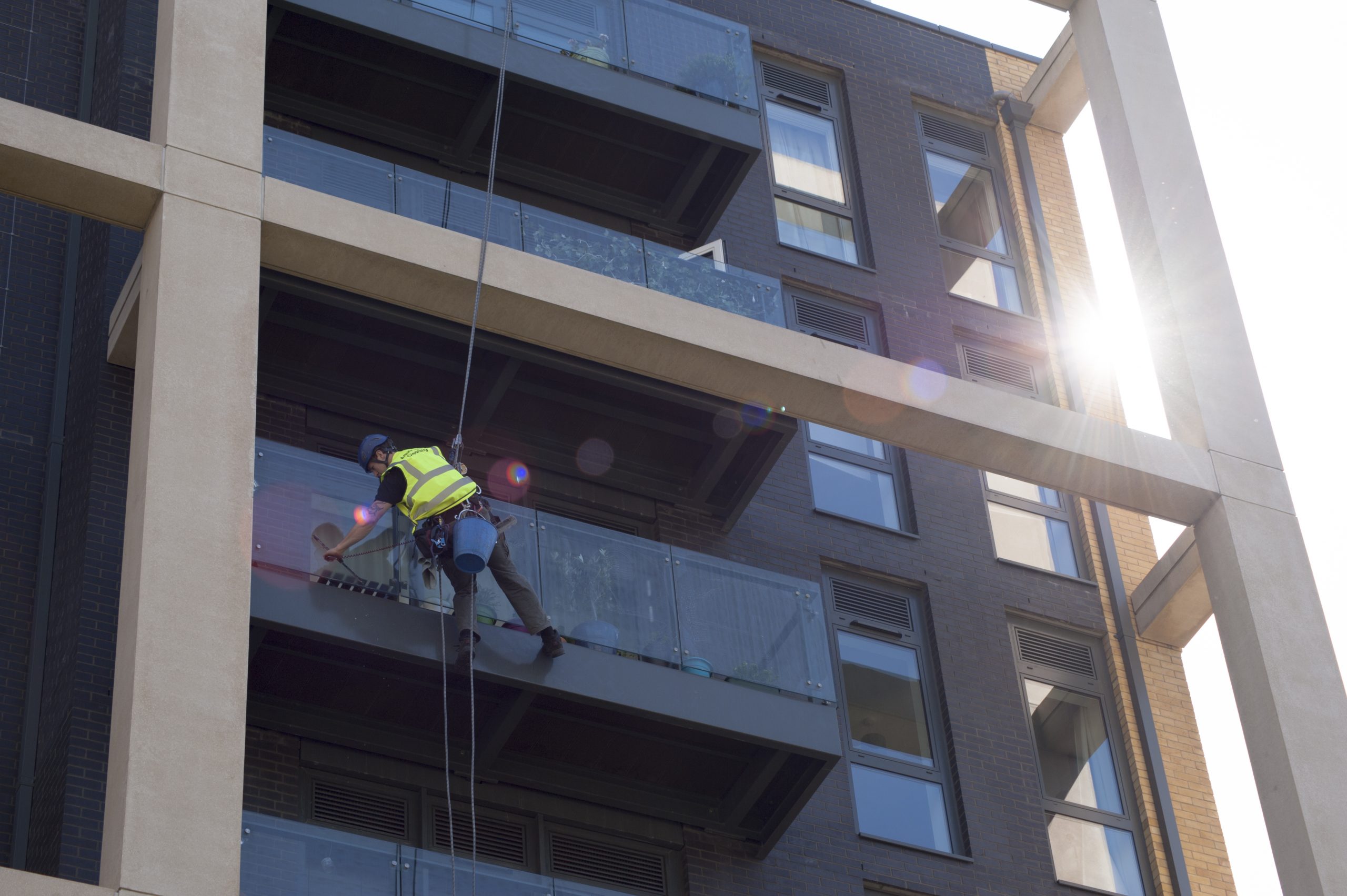Abseiling Window Cleaning Vs Cradle Cleaning